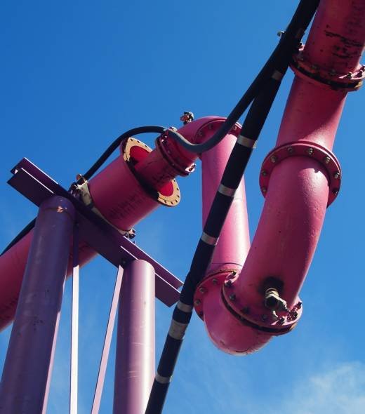 Drainage pipes of a large construction site against blue sky in Frankfurt. Deep construction pits of skyscrapers require extensive water management.